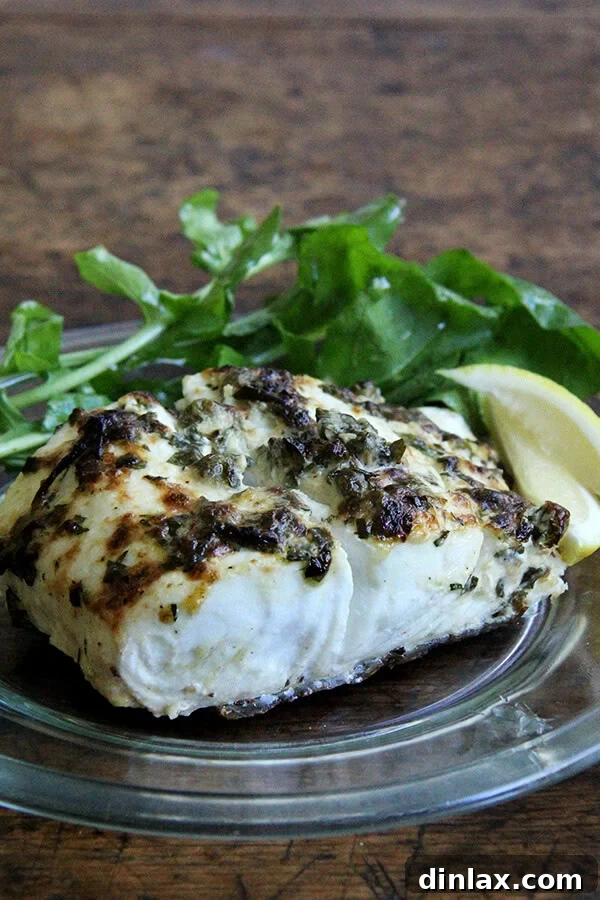 Pan-broiled halibut fillets with a zesty lemon-caper mayonnaise crust, ready for serving.