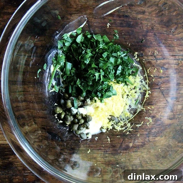 A perfectly cooked pan-broiled halibut fillet, golden and flaky.