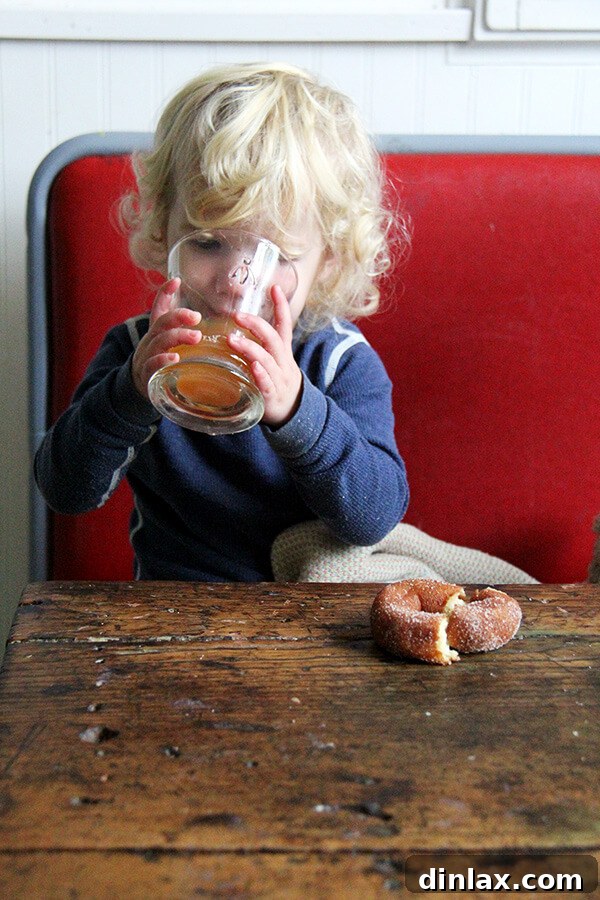 Tig enjoying a cup of apple cider.