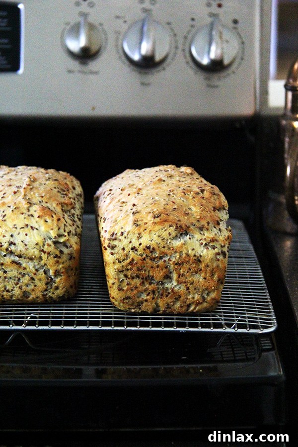The baked quinoa and flax bread, sliced to reveal its airy crumb and textured interior, ideal for toasts or sandwiches.