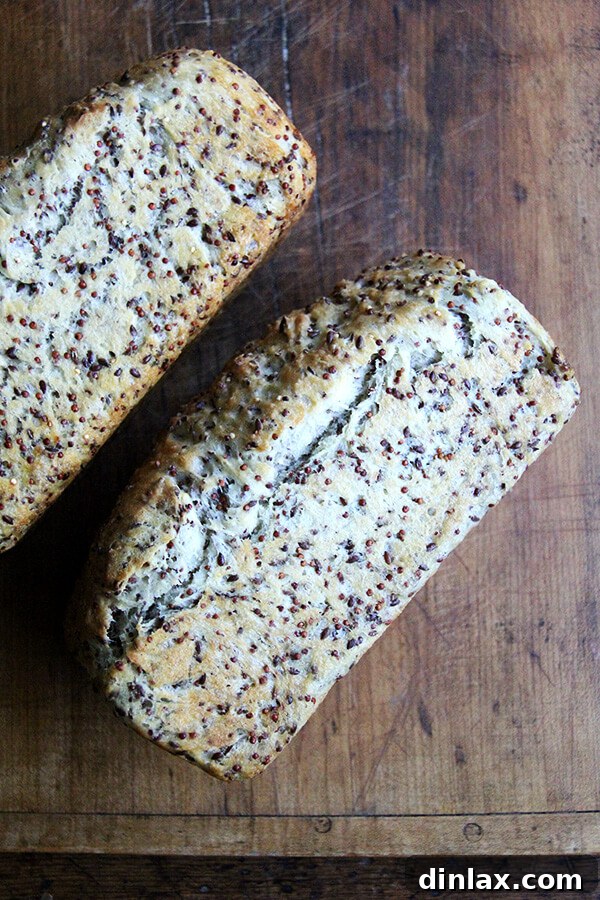Cooling quinoa and flax bread on a wire rack, allowing it to set and develop its full flavor and texture before serving.