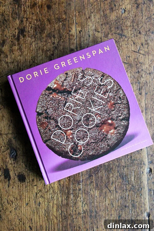 Dorie Greenspan's Classic Vanilla Bean Sablés 16 Dorie's Cookies, a beautiful cookbook, resting open on a wooden table, inviting readers to explore its recipes.