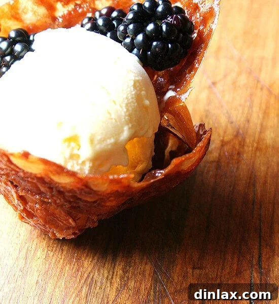 Crispy and golden almond-butterscotch cookie cups, perfect for holding ice cream or other delightful fillings.