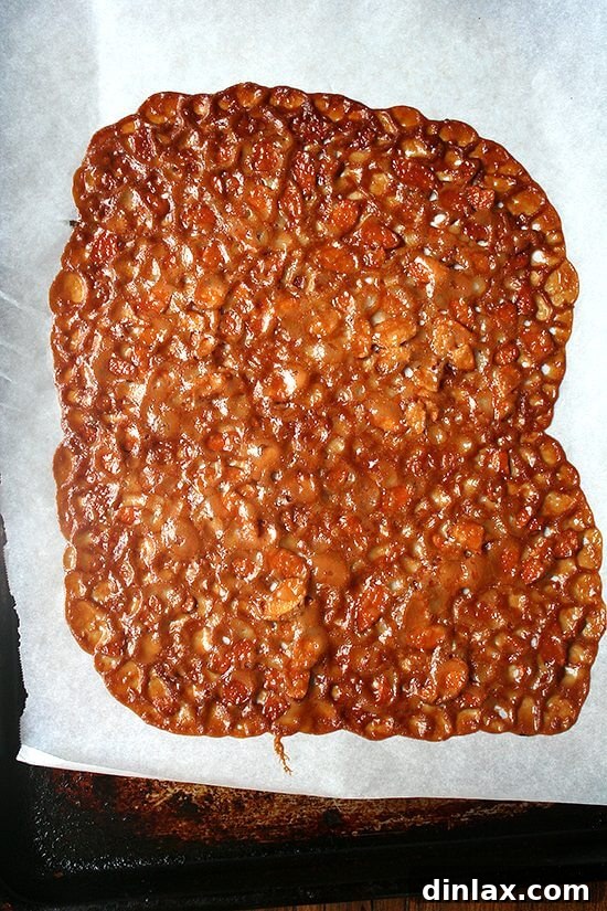 Almond Butterscotch Cookie Cups Filled with Crème Fraîche Ice Cream 2 A batch of freshly baked, golden-brown almond butterscotch cookies, cooling on a baking sheet before being shaped into cups.