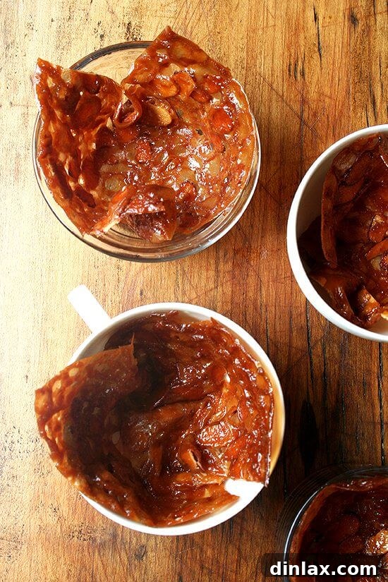Almond Butterscotch Cookie Cups Filled with Crème Fraîche Ice Cream 3 A close-up view of a beautifully formed almond butterscotch cookie cup, showcasing its delicate, lacy texture.