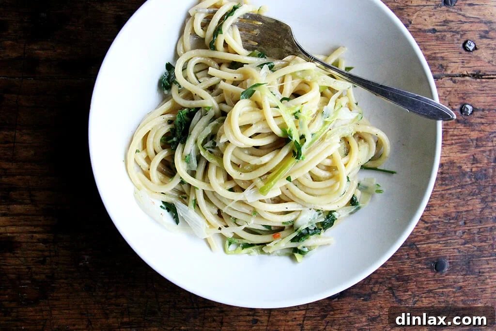Sunny Lemon Leek Bucatini Skillet 7 Finished one-pan bucatini with leeks and lemon, garnished and ready to serve, showcasing the creamy sauce.