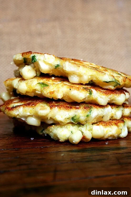 Irresistible crispy corn fritters, golden brown and bursting with fresh corn kernels. Perfect with broiled fish or a simple citrus salad. Find this easy recipe at alexandracooks.com.