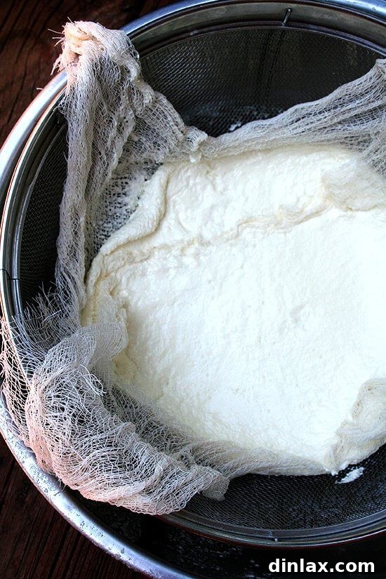 Classic Margherita Pizza with Marcella Hazan's Signature Tomato Sauce and House-Made Ricotta 8 Freshly made ricotta cheese is being strained through a fine cheesecloth, separating the curds from the whey.