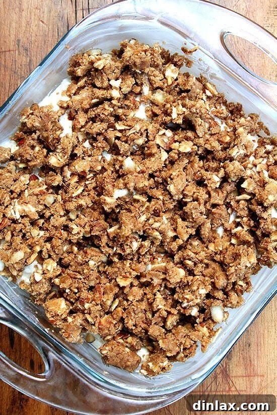 Unbaked Coffee Cake Prepared for Baking Unbaked coffee cake batter with streusel topping evenly spread, ready for the oven.