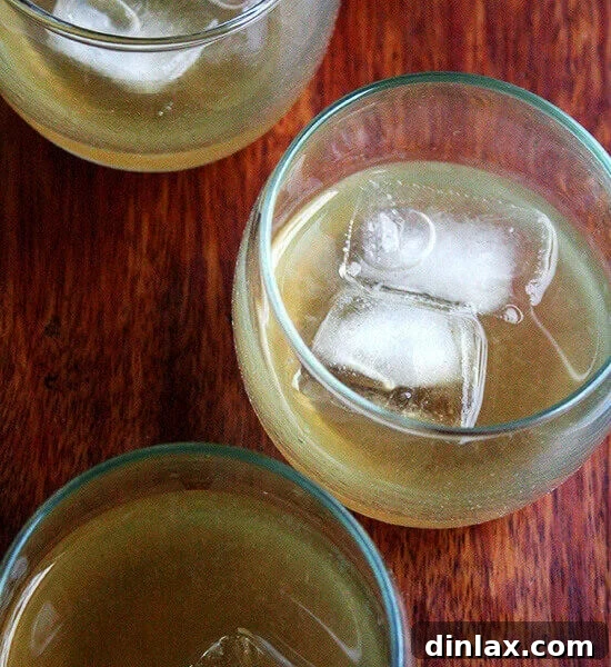 A vibrant punch bowl filled with Philadelphia Fish House Punch, garnished with lemon slices and an ice ring, promising a festive celebration.