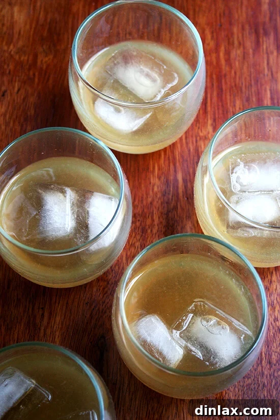 Several punch glasses, meticulously filled with the refreshing Philadelphia Fish House Punch, prepared for guests to enjoy.
