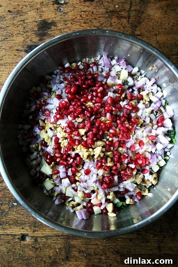 Jeweled Fall Tabbouleh 4 Juicy, jewel-toned pomegranates, ready to be deseeded for the refreshing tabbouleh.