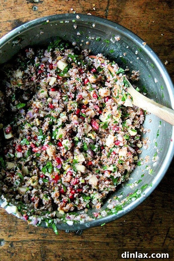 No-Cook Fall Tabbouleh: A Quick and Healthy Dish A generous serving of Fall Tabbouleh Salad, showcasing the beautiful mix of pomegranates, apple, and walnuts.