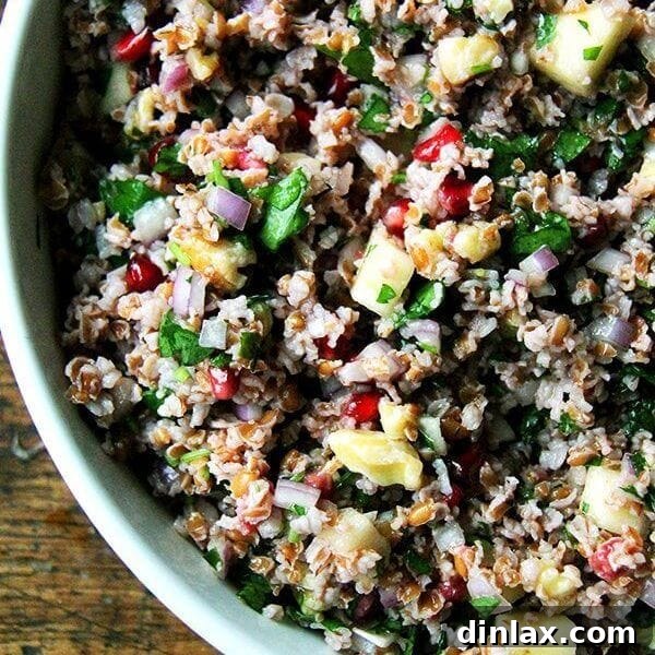 Fall Tabbouleh Salad with a mix of pomegranates, apples, and walnuts, offering a refreshing and healthy dish.