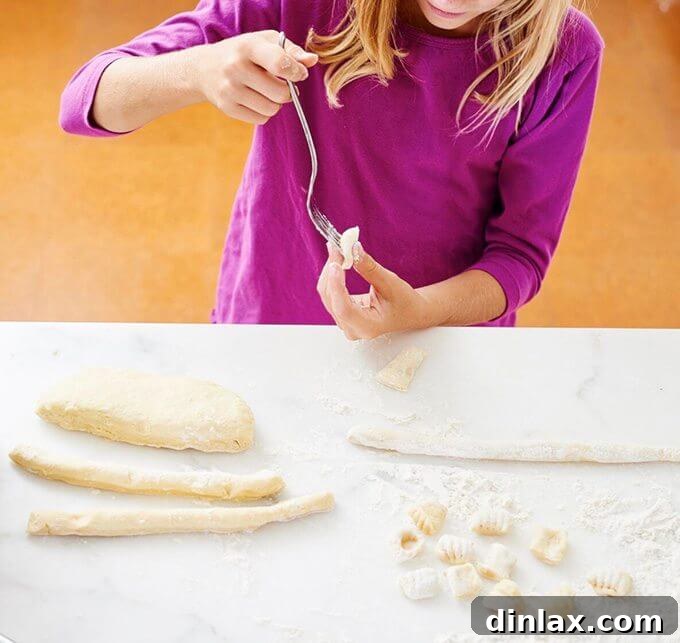 Jenny Rosenstrach's daughter making gnocchi, illustrating a weekend project cooking activity.