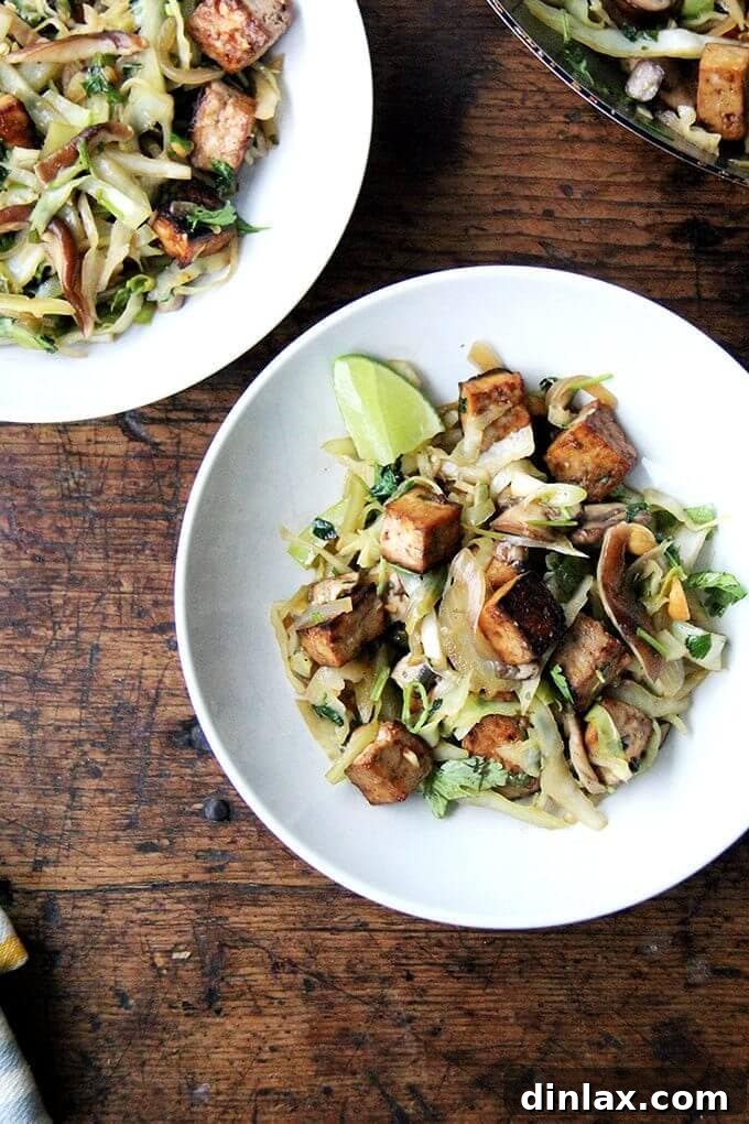 Vibrant Cabbage Pad Thai-ish with baked tofu and fresh cilantro, showcasing its noodle-free goodness.