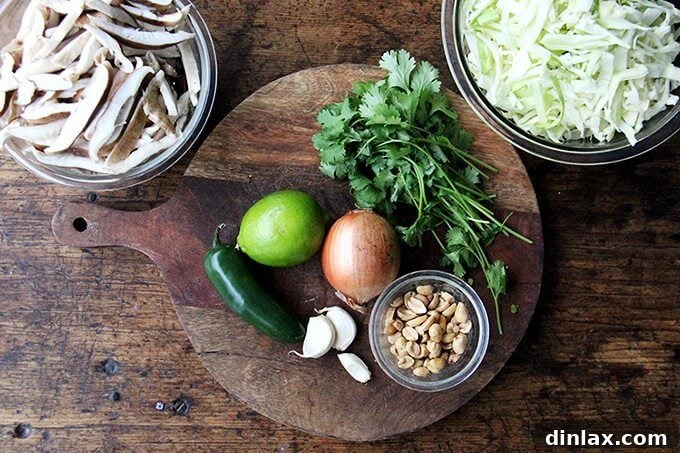 Cabbage Pad Thai-ish in a serving bowl, garnished with fresh cilantro and crushed peanuts.