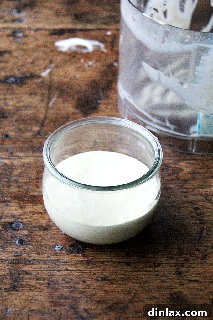 Ingredients for the vibrant vegan Caesar dressing, including fresh lemon, Dijon mustard, and vegan Worcestershire sauce.