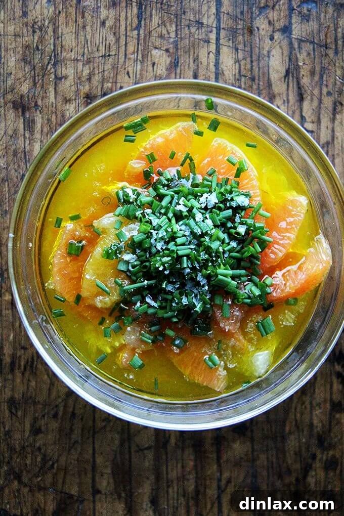 A close-up of the bright and tangy citrus sauce in a small serving bowl.