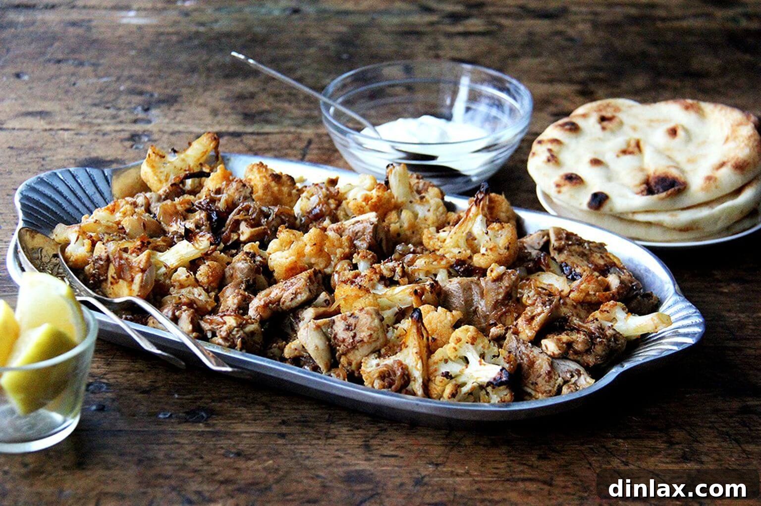 A beautifully arranged platter of sheet pan chicken and cauliflower shawarma, ready to be served.