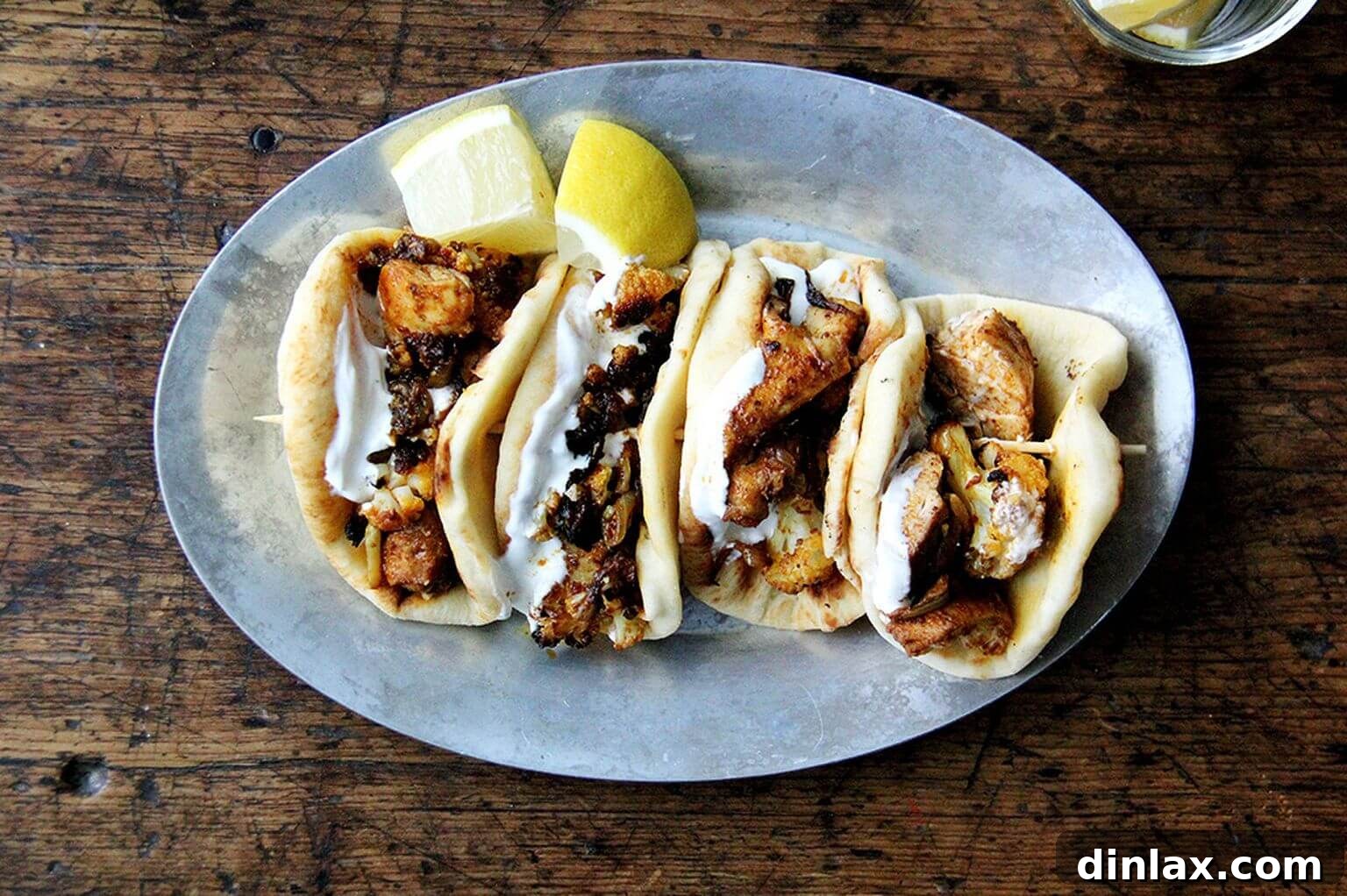 A sizzling hot sheet pan of chicken and cauliflower shawarma, fresh out of the oven.