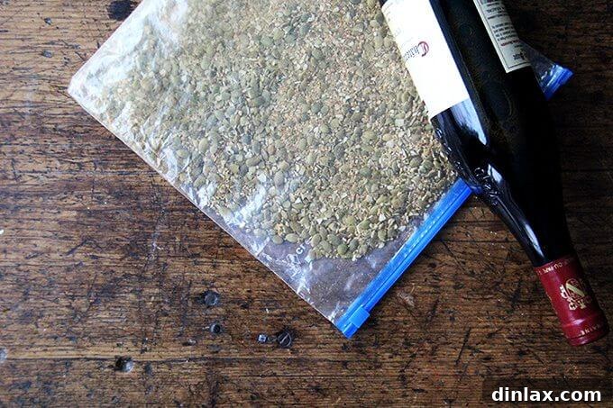 A close-up view of the Pepita-Crusted Chicken Cutlets being pan-fried to a perfect golden crisp.