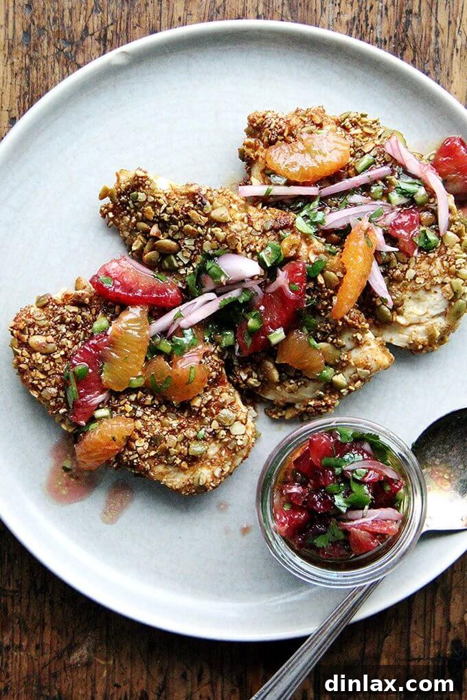 Vibrant orange salsa, a perfect fresh and zesty accompaniment for the Pepita-Crusted Chicken Cutlets.