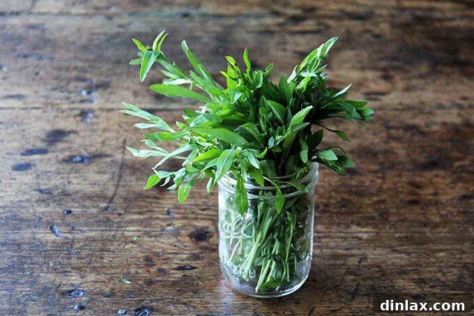 Close-up view of the hearty roasted vegetable and lentil salad, showcasing its rich textures and colors.