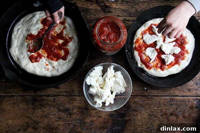 Mastering Skillet Pizza Perfection 13 Two kids top two cast iron skillet pizzas.