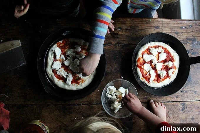 Mastering Skillet Pizza Perfection 14 Three kids top two cast iron skillet pizzas.