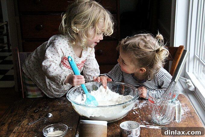 Mastering Skillet Pizza Perfection 4 Sideview of two kids making pizza dough.