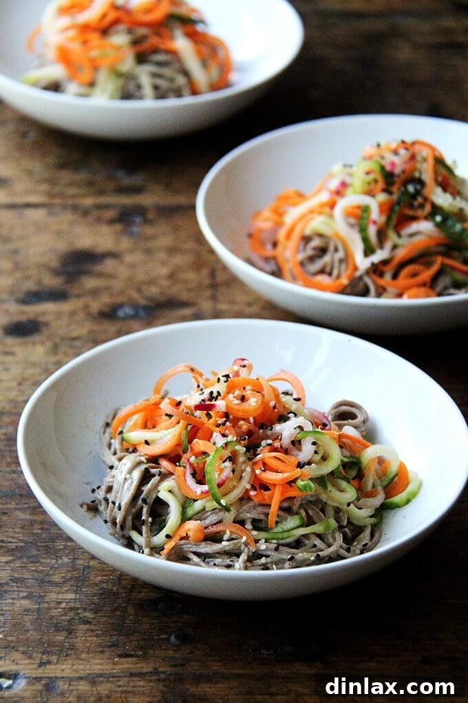 Almond-Sesame Soba Noodles with Quick-Pickled Vegetables: A Healthy and Easy Meal Idea A close-up view of the perfectly tossed Almond-Sesame Soba Noodles, showcasing the rich dressing and colorful quick-pickled vegetables, ready for a delightful meal. This healthy, easy, and refreshing dish is ideal for summer.