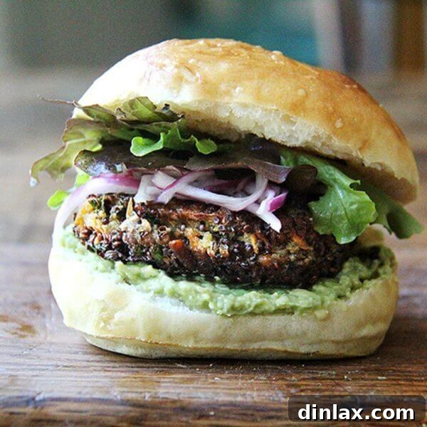 A mushroom-quinoa veggie burger on a board.