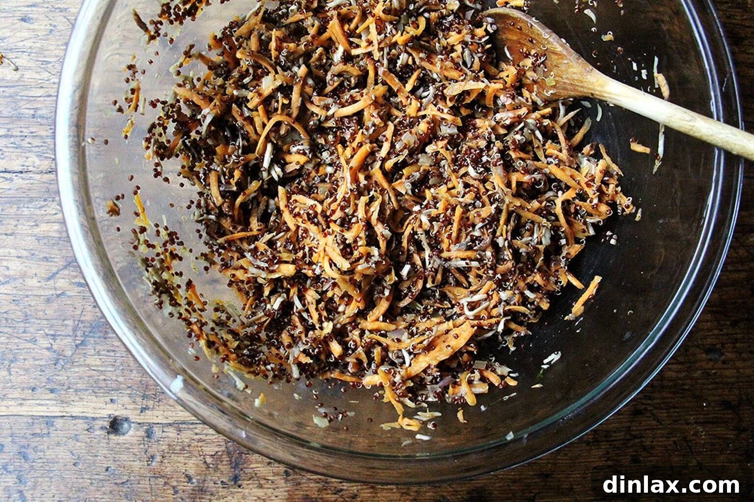 A large mixing bowl containing the vibrant shredded sweet potatoes and mushrooms, awaiting the addition of other key ingredients for the veggie burgers.