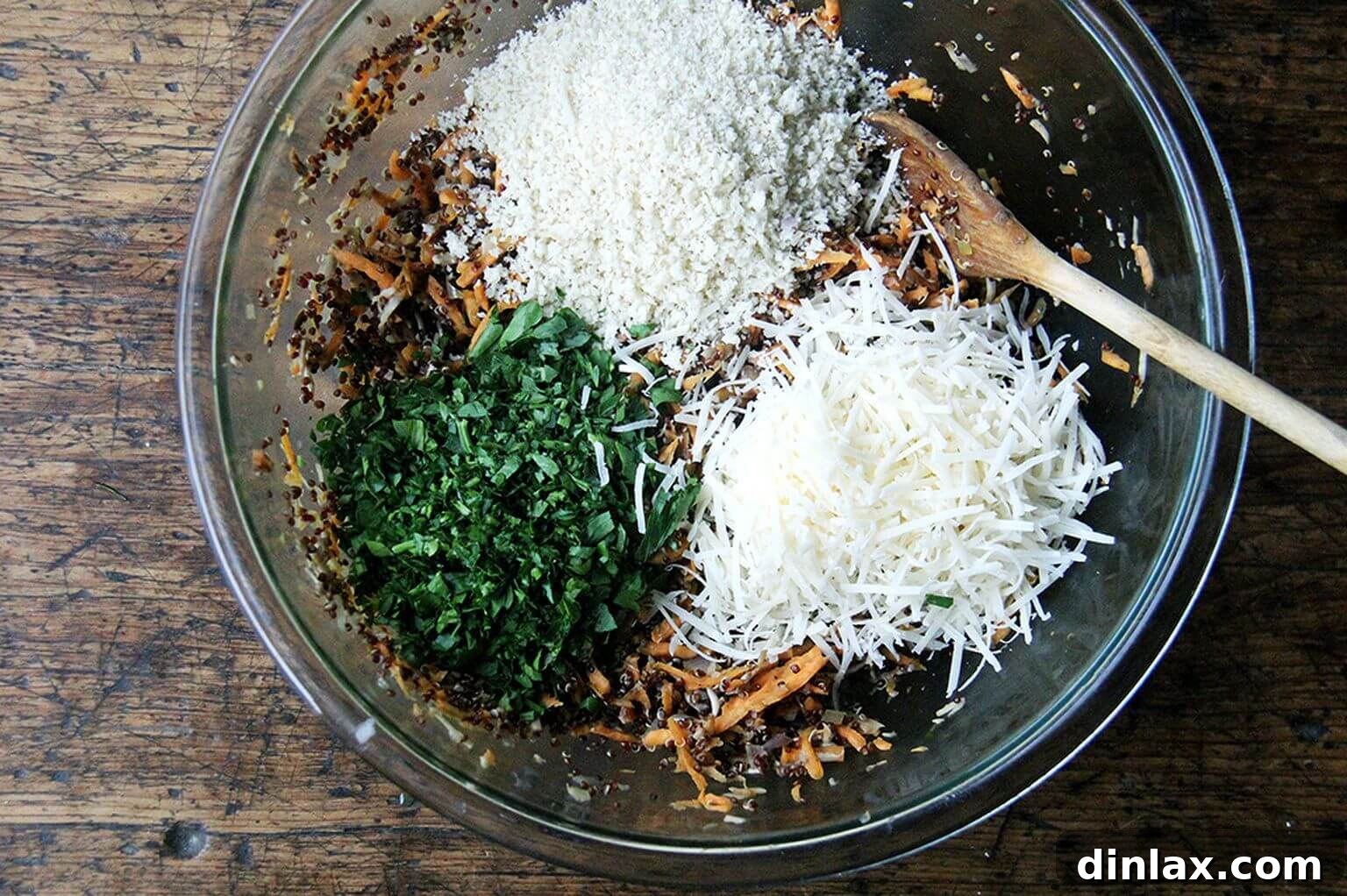 The bowl now filled with the full blend of grated sweet potatoes, mushrooms, fresh herbs, bread crumbs, and grated cheese, showcasing a beautiful mix of textures and colors.