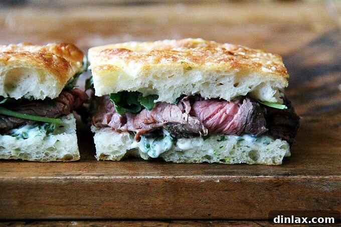 Quick Skirt Steak Sandwiches with Creamy Herb Mayo and Fresh Arugula 3 Close-up of a perfectly cooked skirt steak, ready for slicing and sandwich assembly.