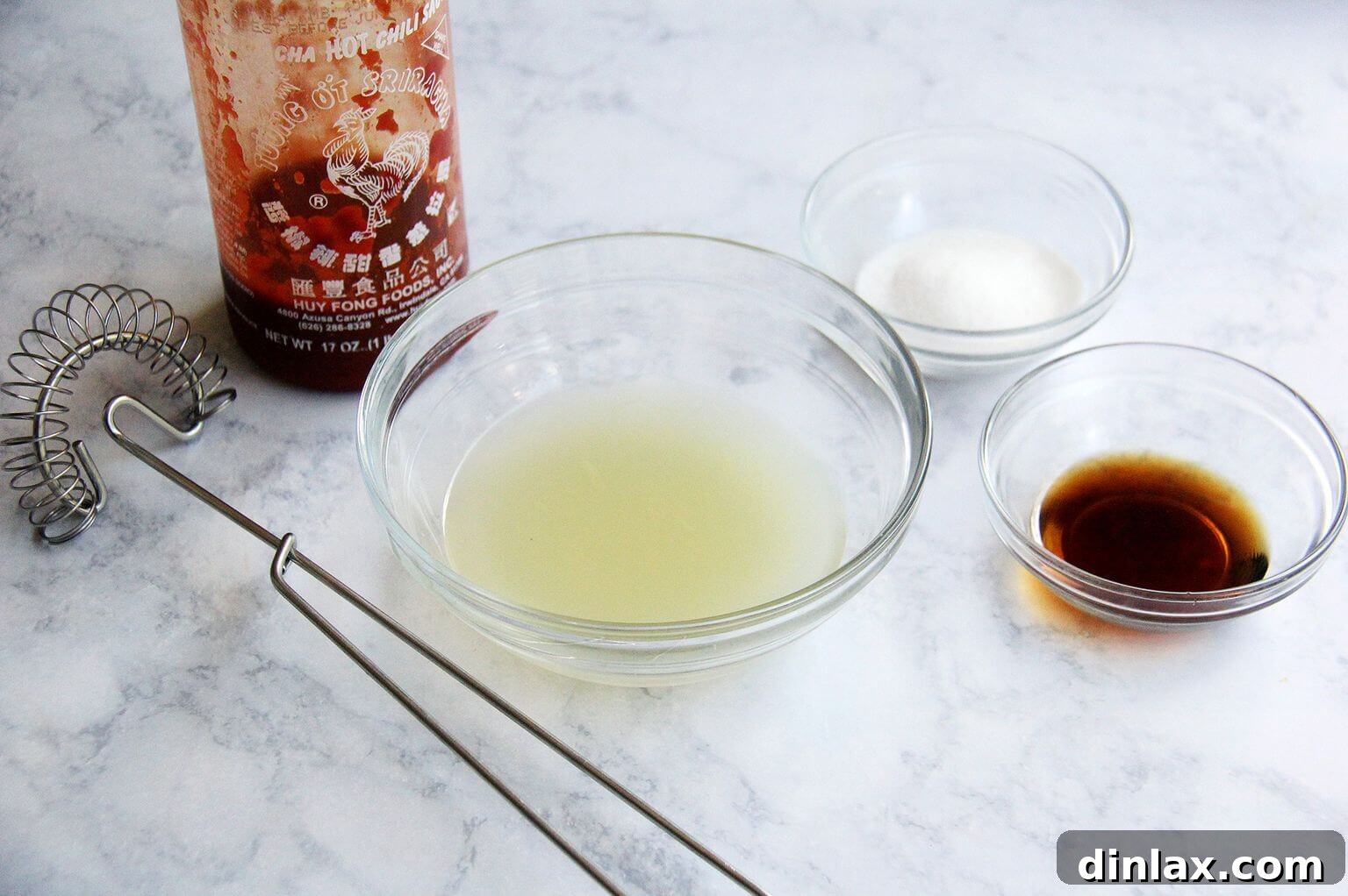 Key dressing ingredients for Thai chicken and cabbage salad: lime, fish sauce, Sriracha, and sugar.