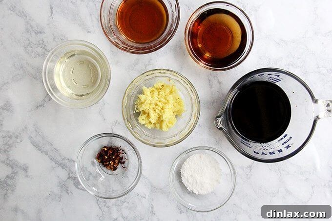 Smoky Cedar Salmon over Ginger Sesame Noodles 2 Fresh ingredients laid out for the salmon marinade and soba noodle dressing: soy sauce, ginger, sesame oil, rice vinegar, mirin, and red pepper flakes.