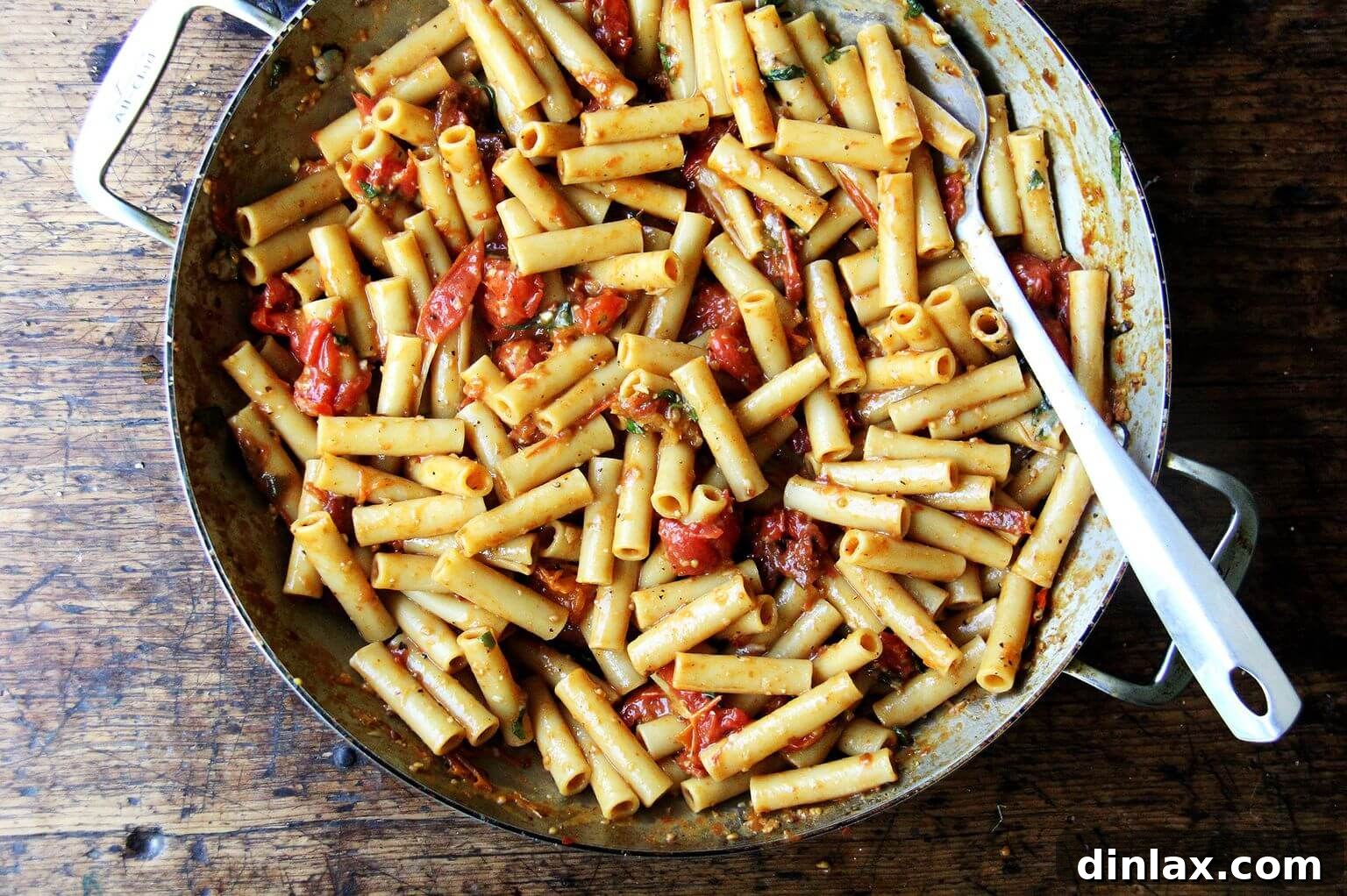 Close-up of the ziti with basil and Parmesan, highlighting the aromatic herbs and cheesy goodness before broiling.