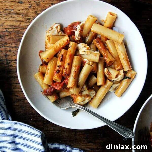 The finished one-pot baked ziti, ready to be served, topped with melted and golden-brown cheese.