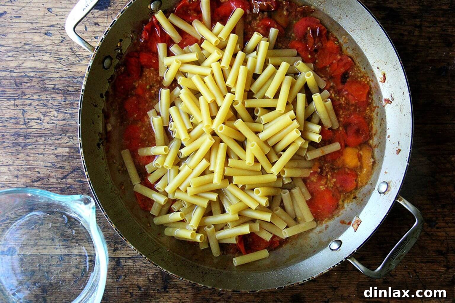 The ziti pasta is now fully cooked and beautifully coated in the rich, flavorful tomato sauce, having absorbed all the liquid.