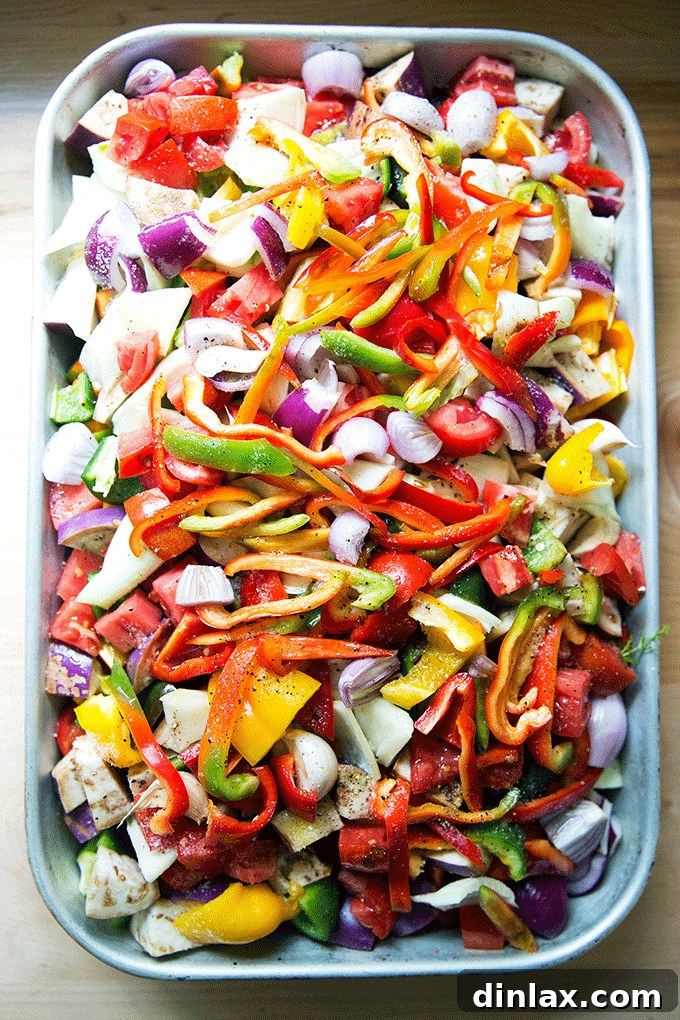 A vibrant animated GIF showcasing uncooked vegetables transforming into perfectly roasted ratatouille, highlighting the ease and delicious outcome of this cooking method.