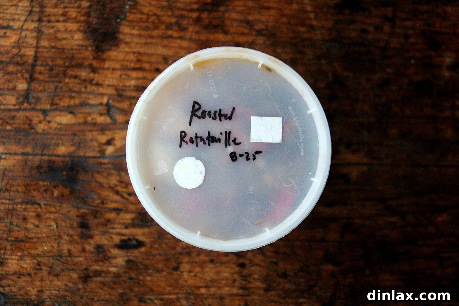 A single quart container packed with rich, roasted ratatouille, illustrating how perfectly it stores for future enjoyment.