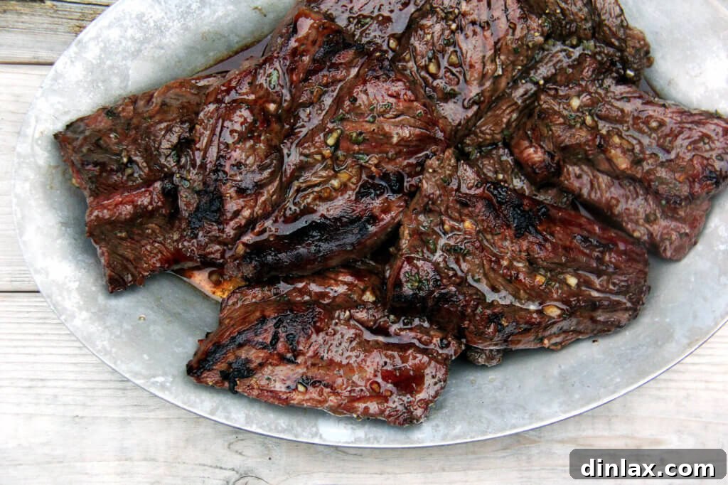 A close-up shot of grilled hanger steak, showcasing its beautiful sear and juicy interior.