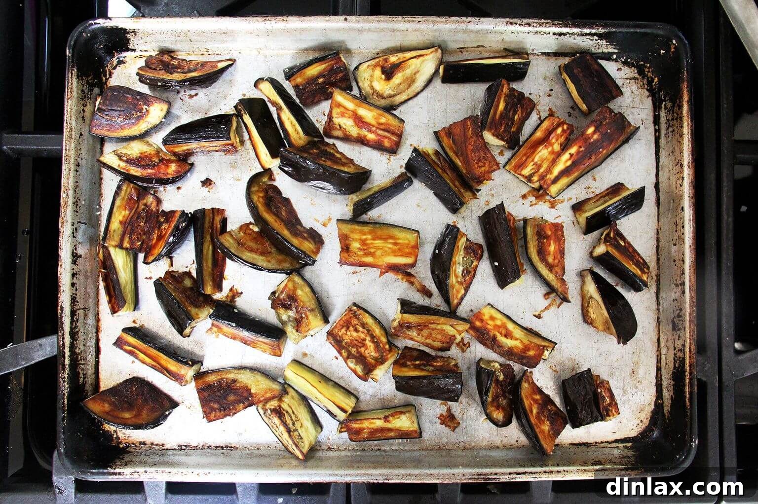 A sheet pan of roasted eggplant.