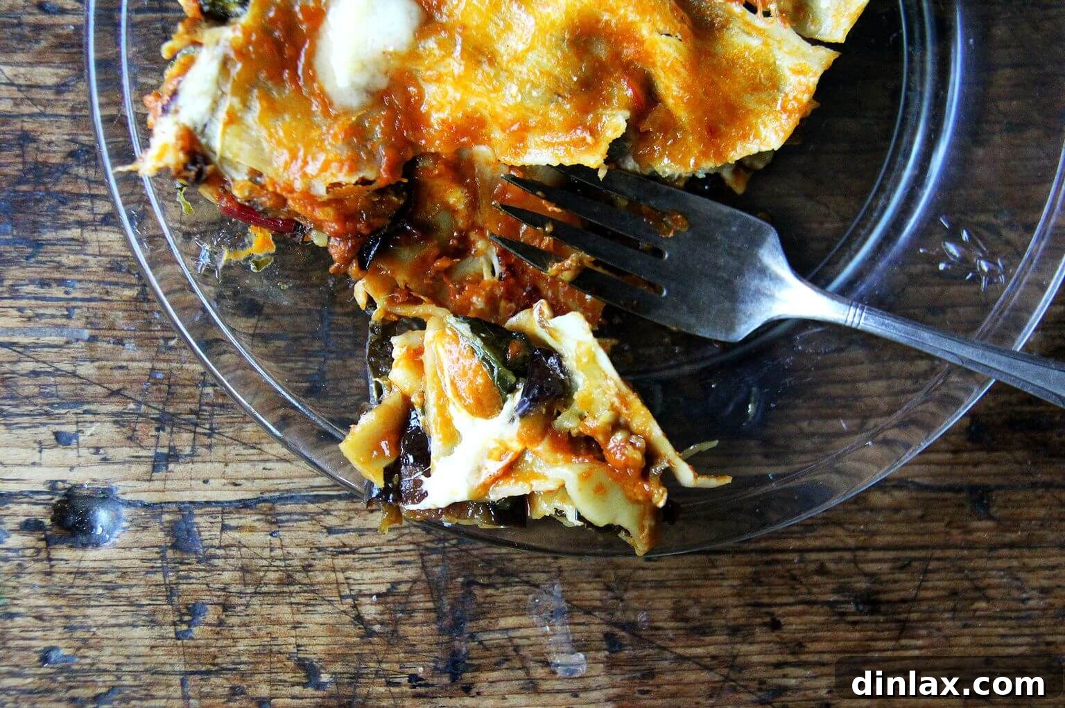 A delightful bite of roasted eggplant and Swiss chard lasagna on a plate.