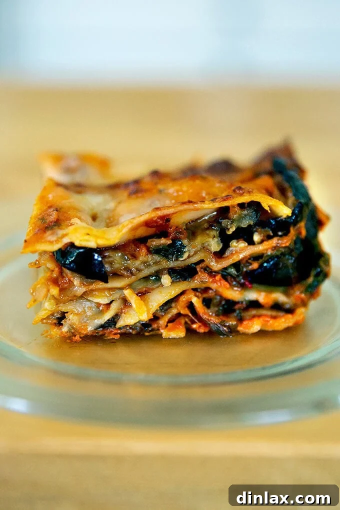 A perfectly baked slice of roasted eggplant lasagna, rich with layers of cheese and vegetables.