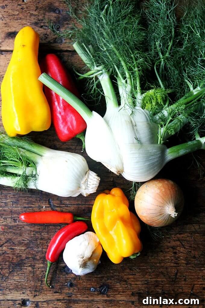 Sliced red peppers, onions, and fennel ready for pickling.
