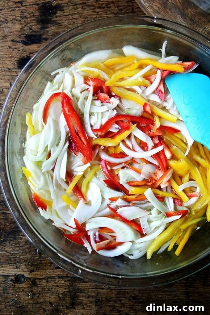 Pickled vegetables submerged in brine in a storage container.