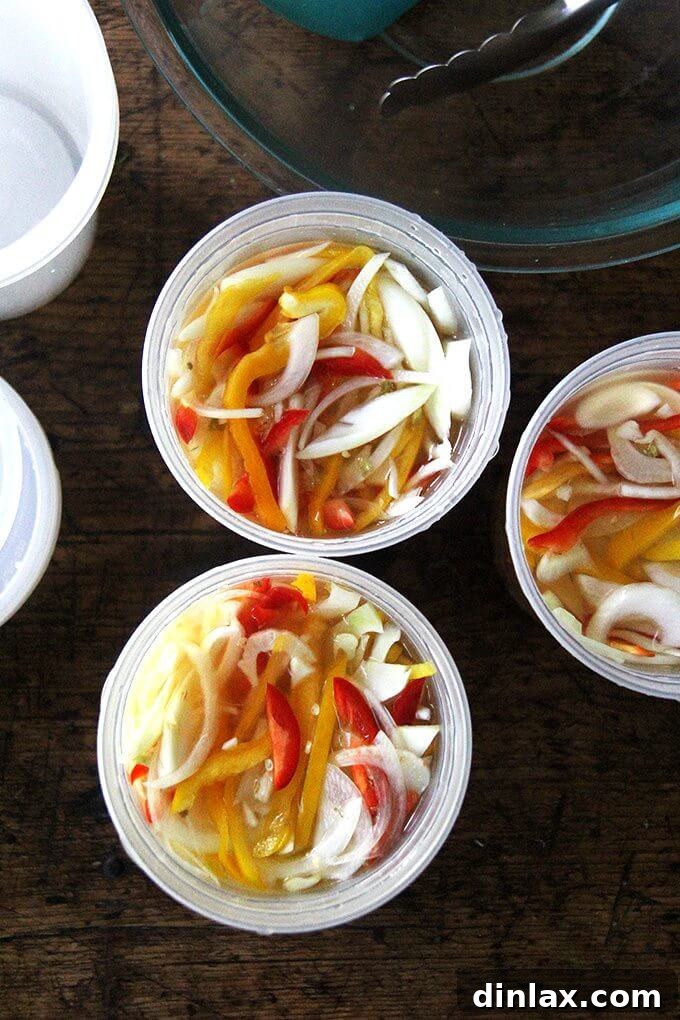 A close-up shot of the finished pickled peppers, onions, and fennel, ready to eat.